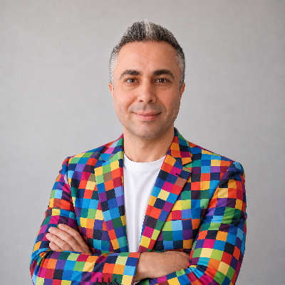 DNworks wearing a colorful pixel-pattern blazer